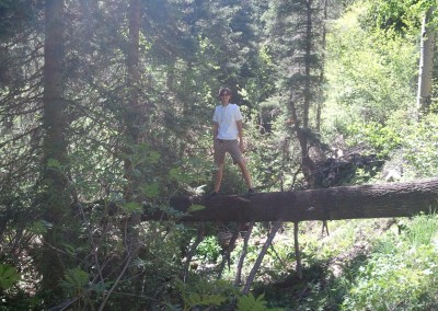 posing on a fallen tree
